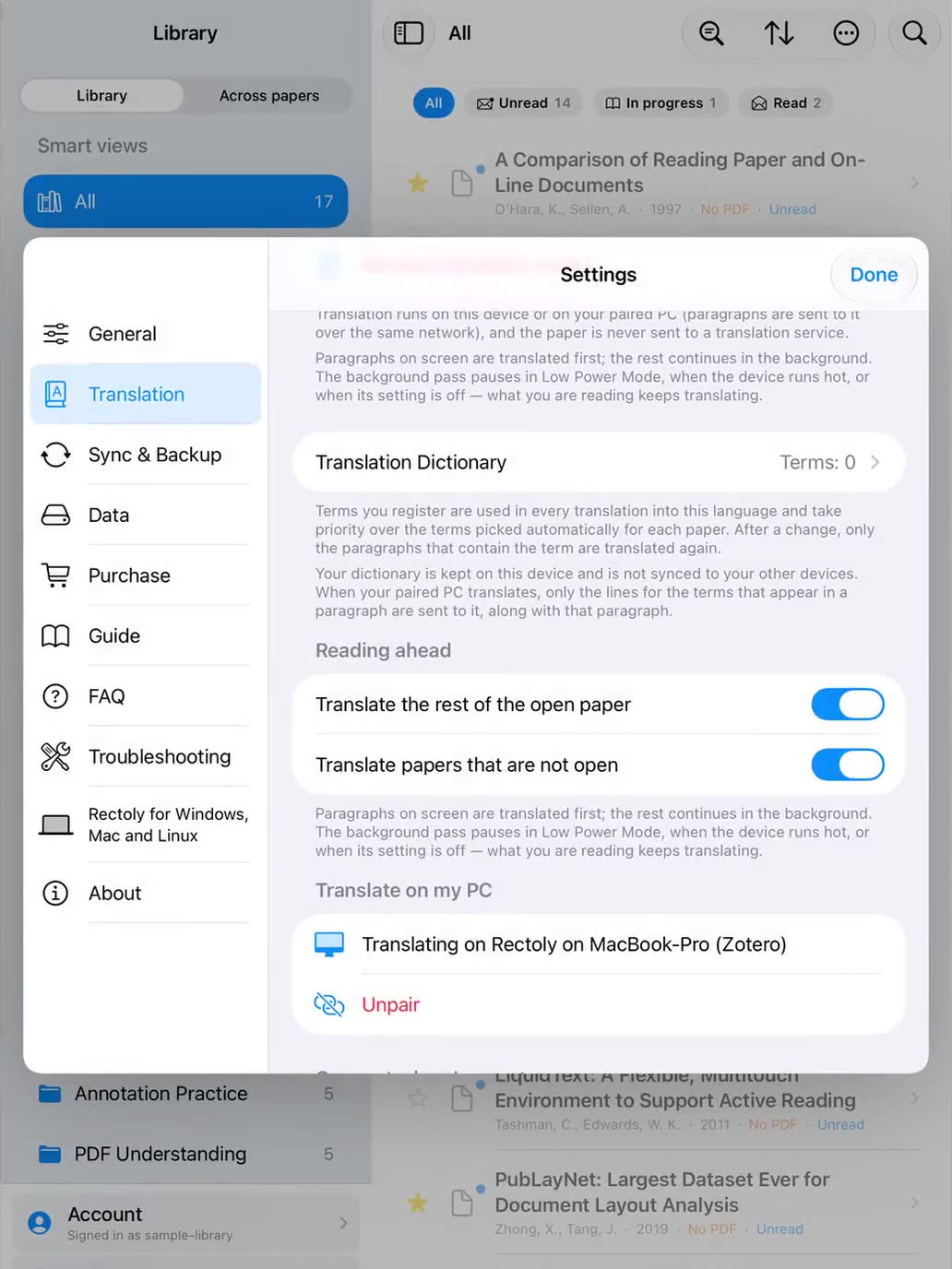 An iPad paired with a computer that is translating a paper for it